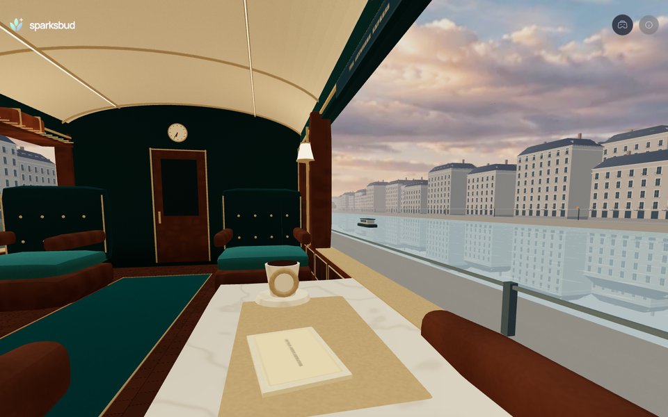 An observation train carriage overlooking a scenic European cityscape in warm light.