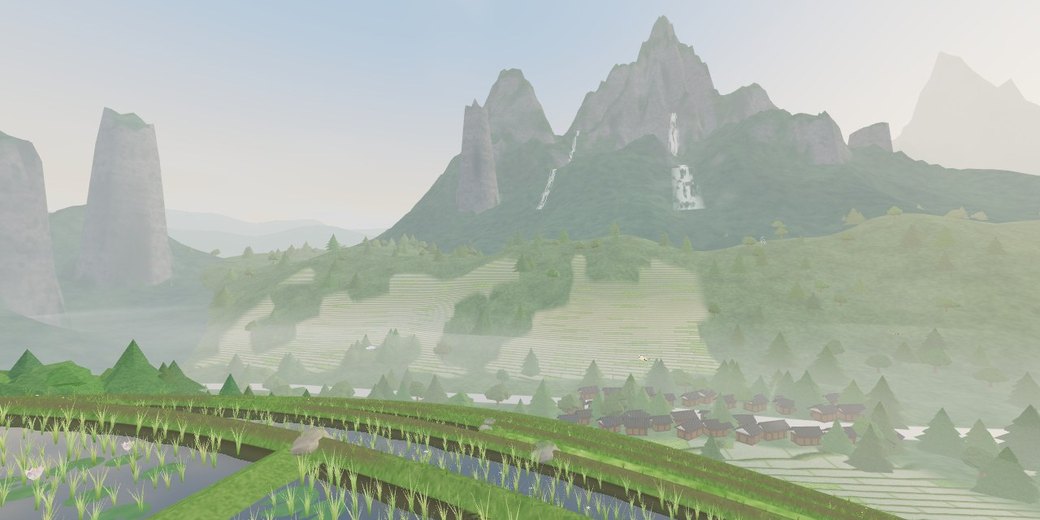 A red paper umbrella looking out over mist-veiled green rice terraces and mountains in the rain.